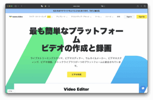 揮手。 日本的 VIDEO 網站將會出現，特色是粗體黑色文字，鼓勵輕鬆製作與錄製影片，背景有色彩繽紛的幾何圖形，並有一個顯眼的黃色按鈕寫著「Video Creation」。